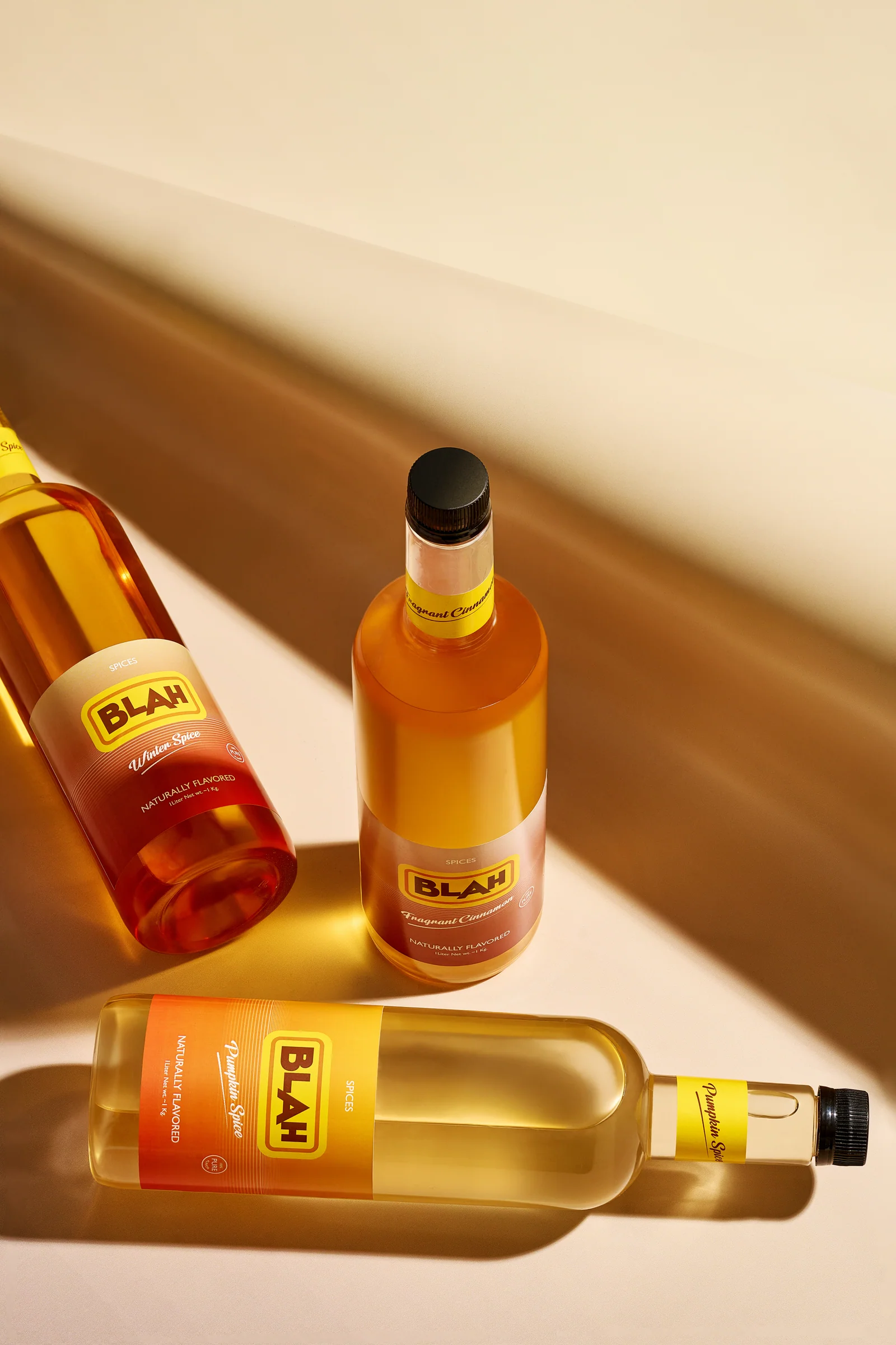 Three Blah spice syrups in warm raking light